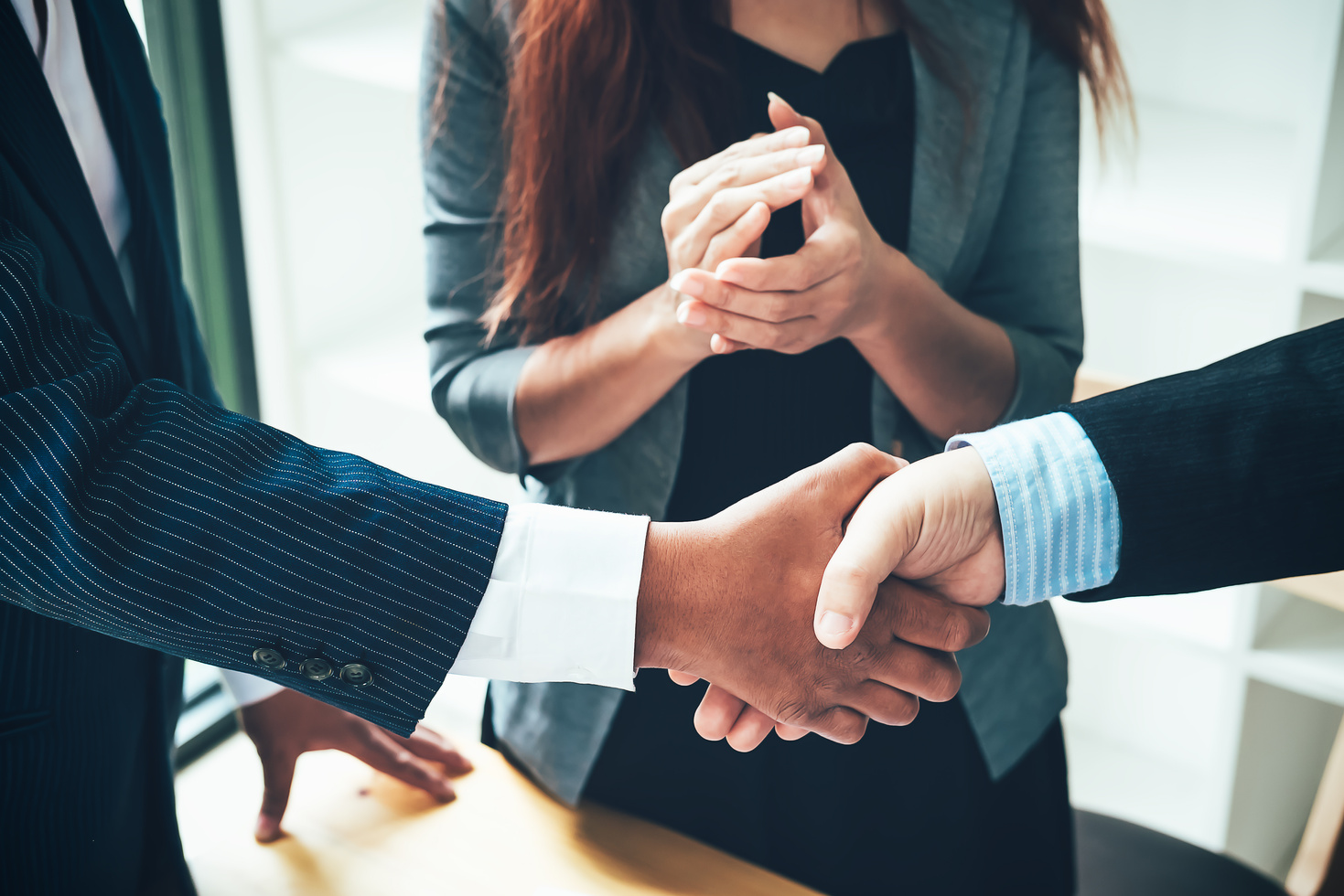 Handshake Between Business People in an Office